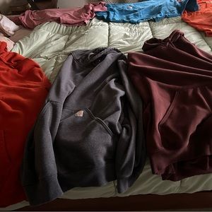 3 Carhartt hoodies. 2 2XLT rain defenders heavy weight, 1 3XLT heavy weight.